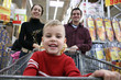 boy with parents in shop