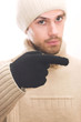 man with hat pointing to the right