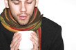 male with shawl and teacup