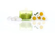 daisies, white river stones and candle