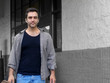 man coming out of store