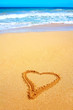 beautiful beach in hawaii with heart scratched into the sand