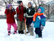 four children playing in the snow