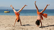 two girls doing cartwheel