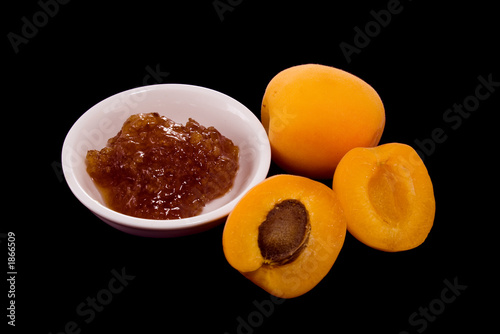 Photo: apricots and apricot jam on black apricots and apricot jam on black