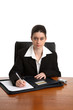 female office worker taking notes
