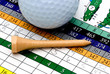 golf tee, scorecard, and ball