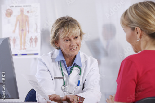 Photo: female doctor and patient female doctor and patient