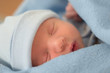sleeping baby in blue blanket
