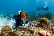 woman diver photographing the reef