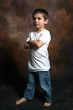boy standing with arms folded