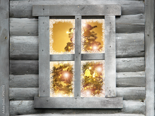 Photo: wooden lodge window with christmas tree wooden lodge window with christmas tree