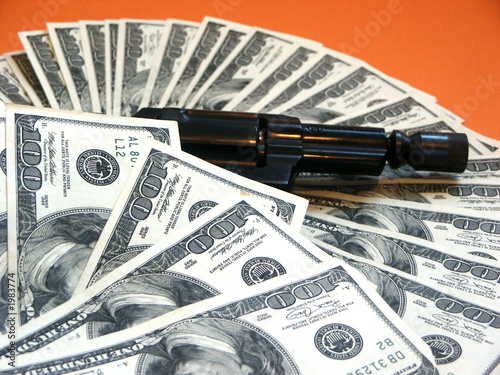 Photo: money and a revolver money and a revolver