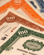 brightly colored stock certificates