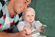 father with baby with extension wrench
