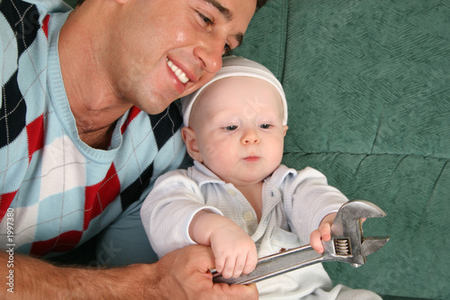 Photo: father with baby with extension wrench father with baby with extension wrench
