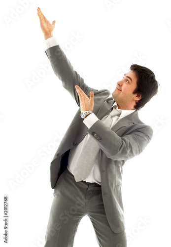 Photo: businessman showing imaginary product businessman showing imaginary product