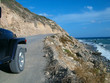 a rocky road aong the beach