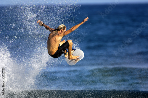 Photo: surfer doing an ariel surfer doing an ariel