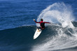 surfer performing a powerful snap