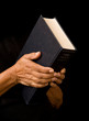 Photo: old woman holding bible old woman holding bible