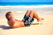 fitness shot of a young man on the beach