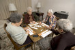 senior woman at the game table senior woman at the game table