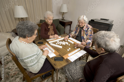 Photo: senior woman at the game table senior woman at the game table
