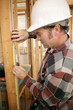 construction worker measuring