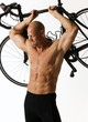 Foto: man holding bike iii man holding bike iii