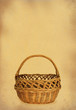 wicker basket against stained retro paper
