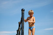 Leinwandbild Motiv small boy and clear blue sky