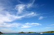 blue sky and wispy clouds, isles of scilly, uk.