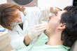 female dentist examining a patient female dentist examining a patient