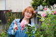 women cut roses in garden women cut roses in garden