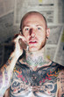 tattoo man on the phone