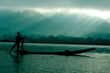 silhouette of fisherman in boat silhouette of fisherman in boat