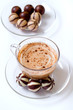 cup of cappucino and candies
