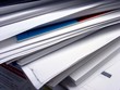 big stack of papers in folder