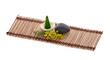 scent, pebble and flower on mat