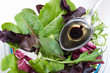 organic salad and spoon of olive oil organic salad and spoon of olive oil