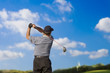Photo: golfer teeing off golfer teeing off