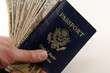 us twenties and passport n hand us twenties and passport n hand