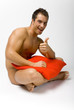gorgeous nacked man with pillow