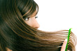 brunette brushes hair