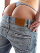 sexy woman trying on a pair of blue jeans sexy woman trying on a pair of blue jeans