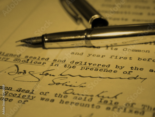 Photo: business document signed with fountain pen business document signed with fountain pen