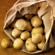overflowing bag of potatos overflowing bag of potatos