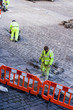 workmen laying cobbles