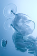 ice cubes in a glass on a reflective surface